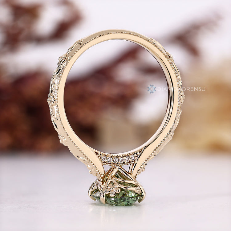 Oval cut ring with milgrain and cathedral setting.