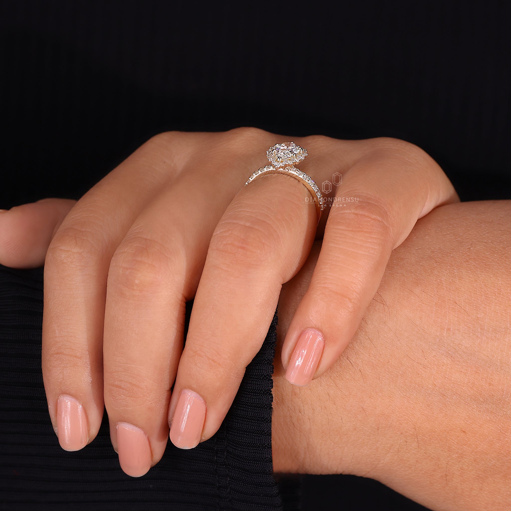 IGI certified pear cut diamond engagement ring with elegant finish.
