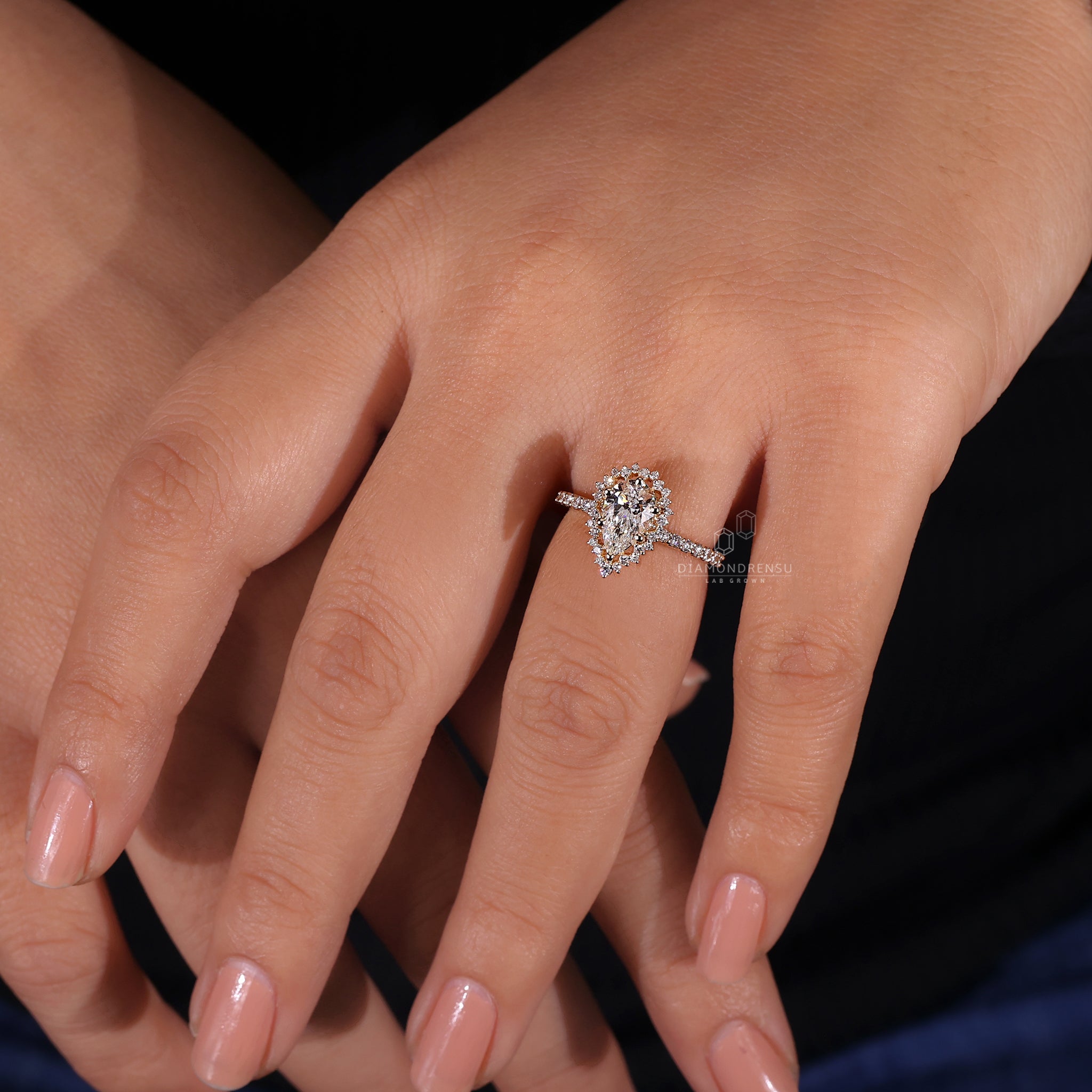 Diamondrensu UK ring with 6 prong ring setting and halo diamond style.
