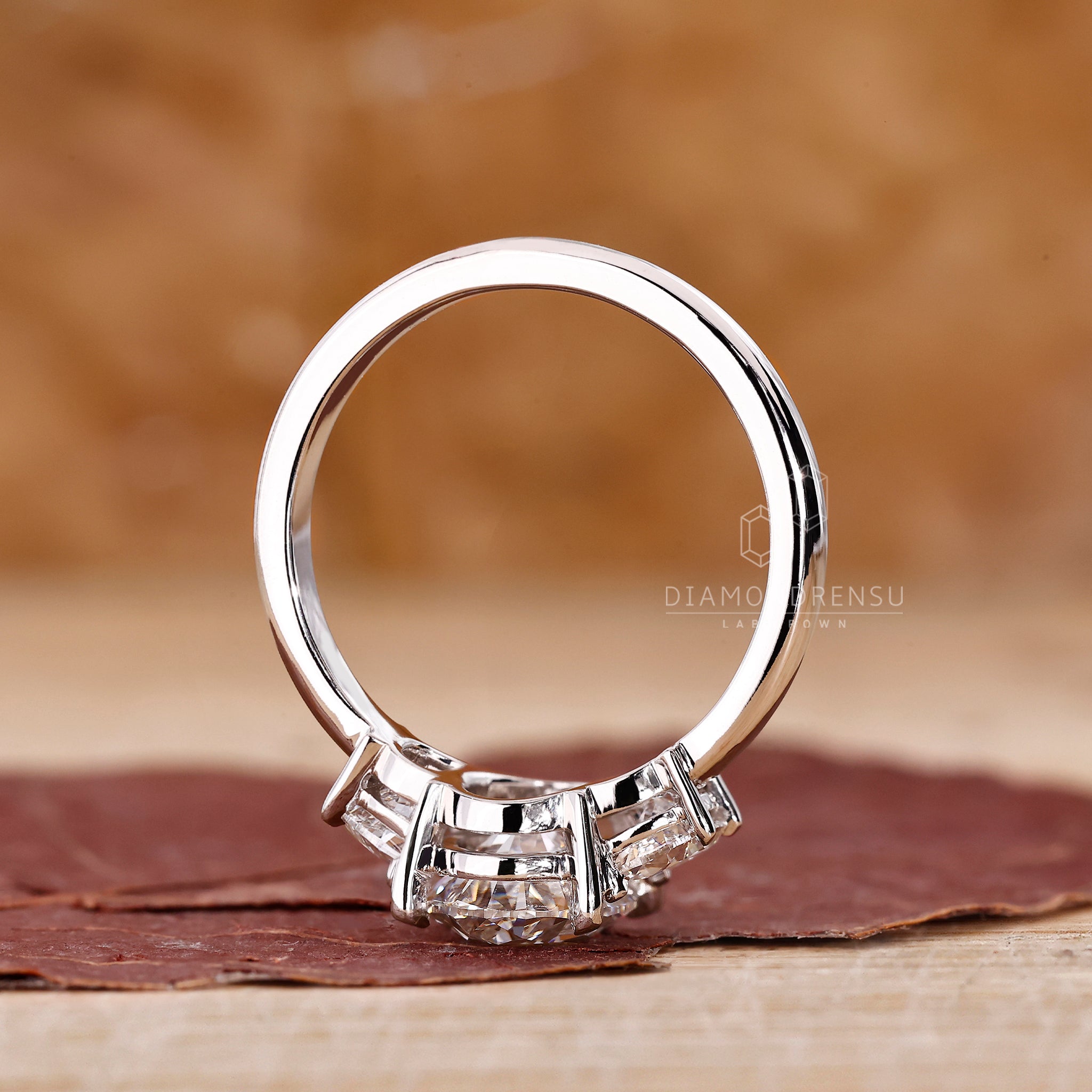 Buy engagement ring with oval and half moon IGI certified stones.
