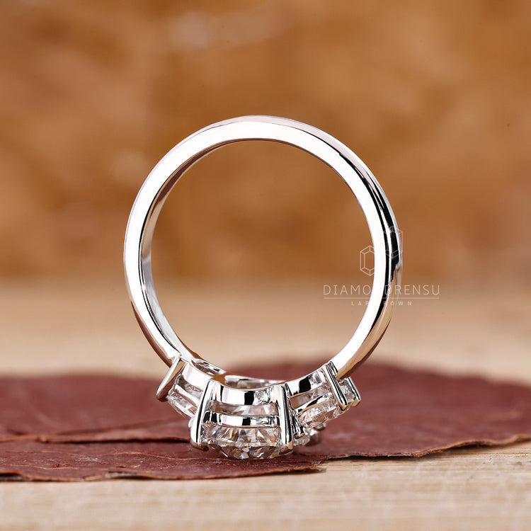 Buy engagement ring with oval and half moon IGI certified stones.
