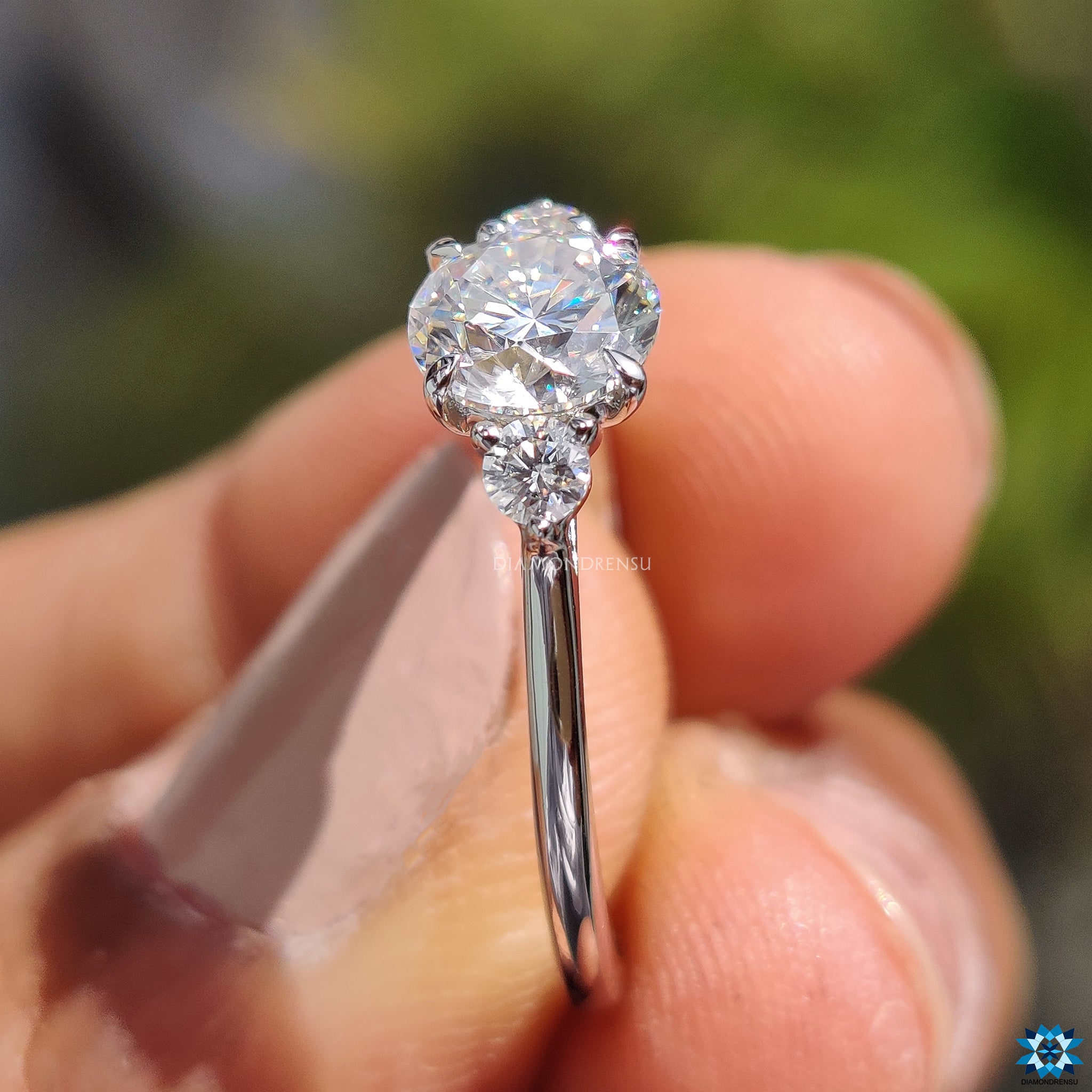 UK engagement ring with classic 3 stone round moissanite design.
