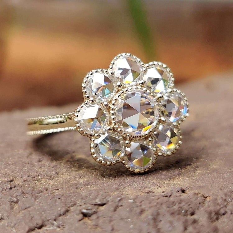 Cluster halo ring with round rose cut moissanite.
