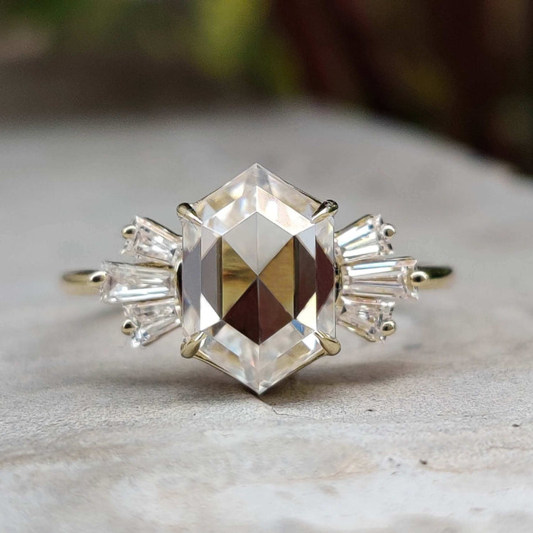 Rose cut hexagon moissanite engagement ring in yellow gold.
