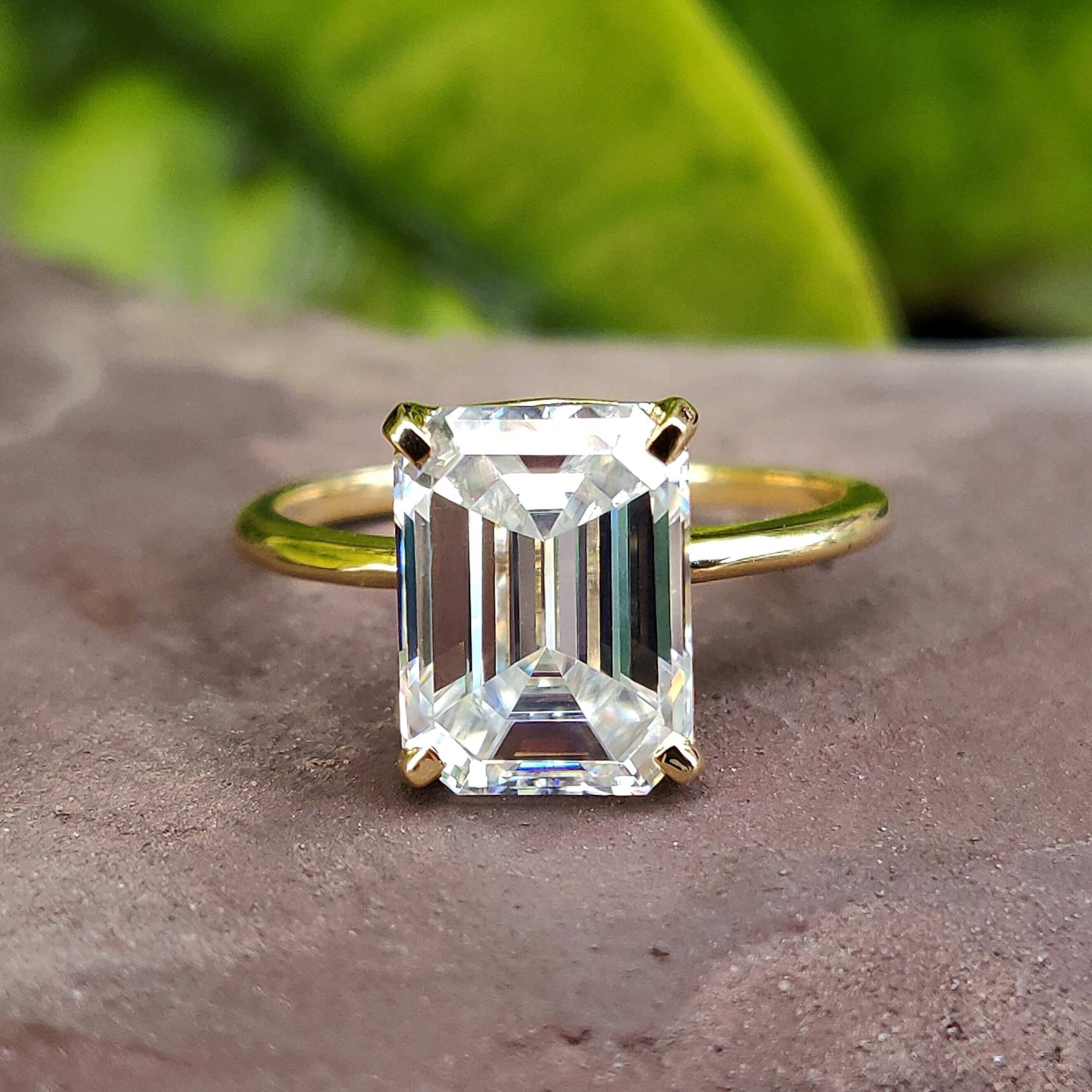 Exquisite emerald cut emerald ring​ showcased in a handmade ring design.
