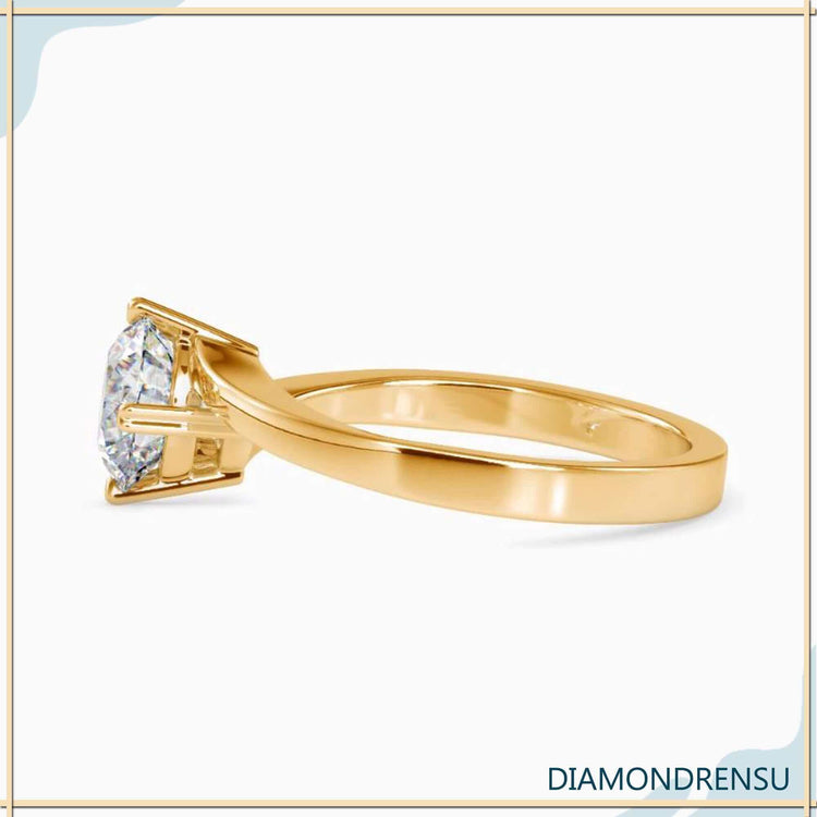 White gold diamond ring with heart prong and lab grown stone.
