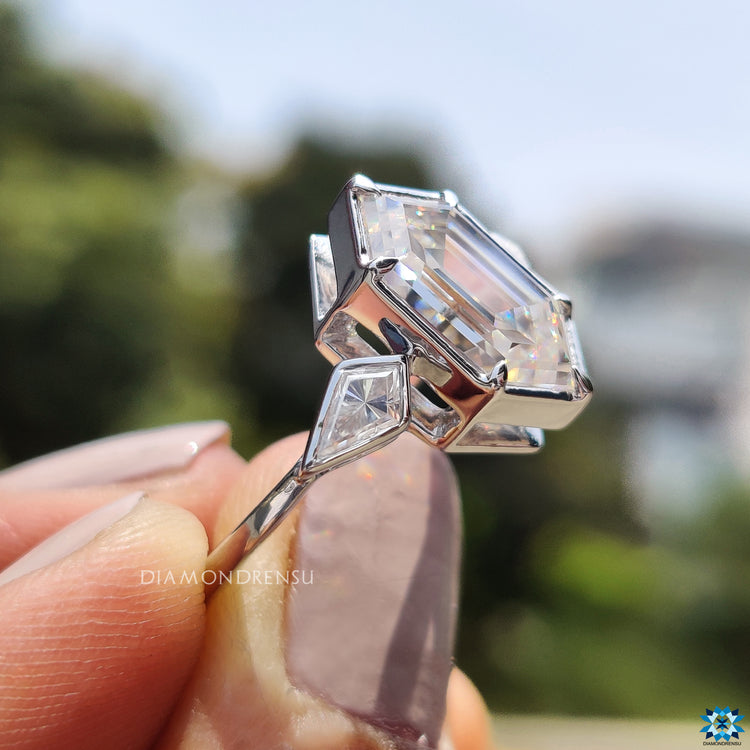 Six claw prong setting enhancing hexagon moissanite in geometric style.
