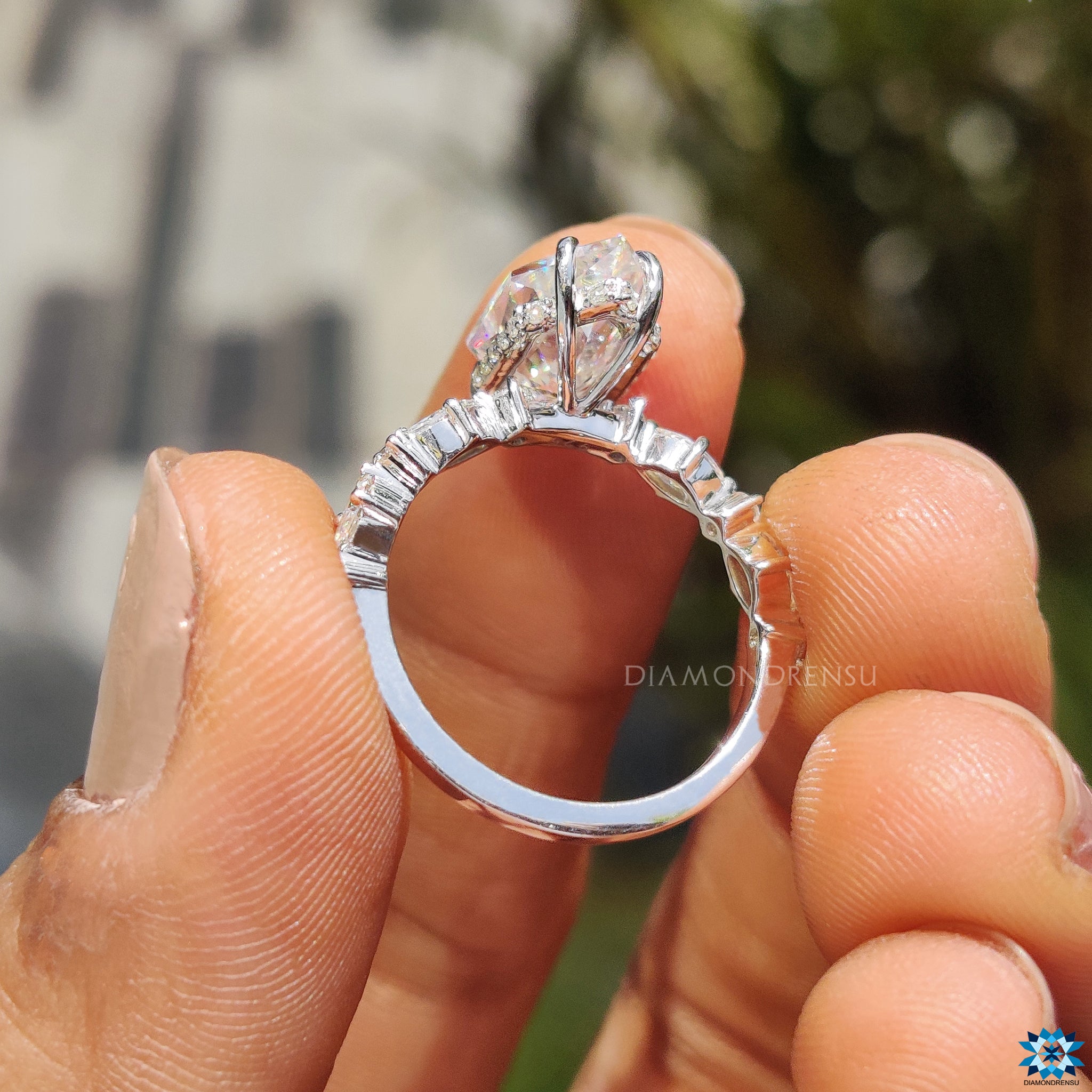 Diamondrensu UK engagement ring featuring hidden halo and side marquise cut.
