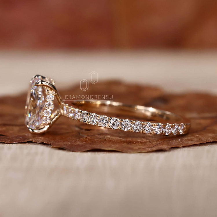 Elongated cushion cut diamond ring paired with a classic claw prong setting.
