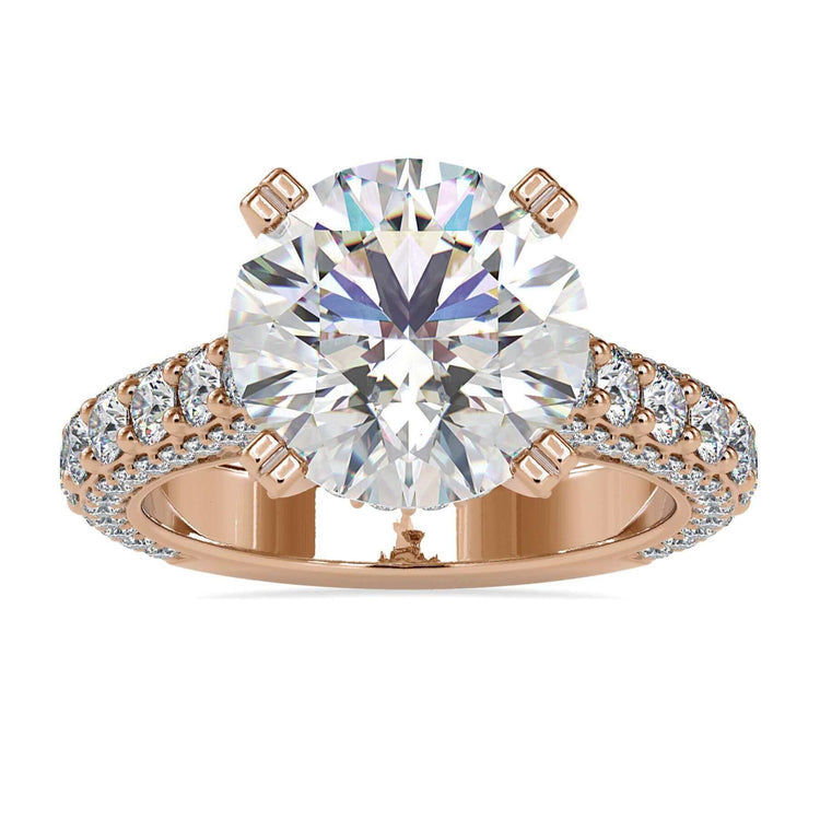 Multi row pave diamond ring with round cut centre.
