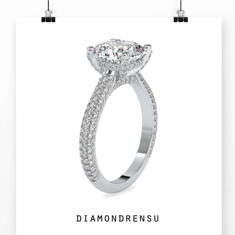 White gold ring featuring cushion cut and pave detail.
