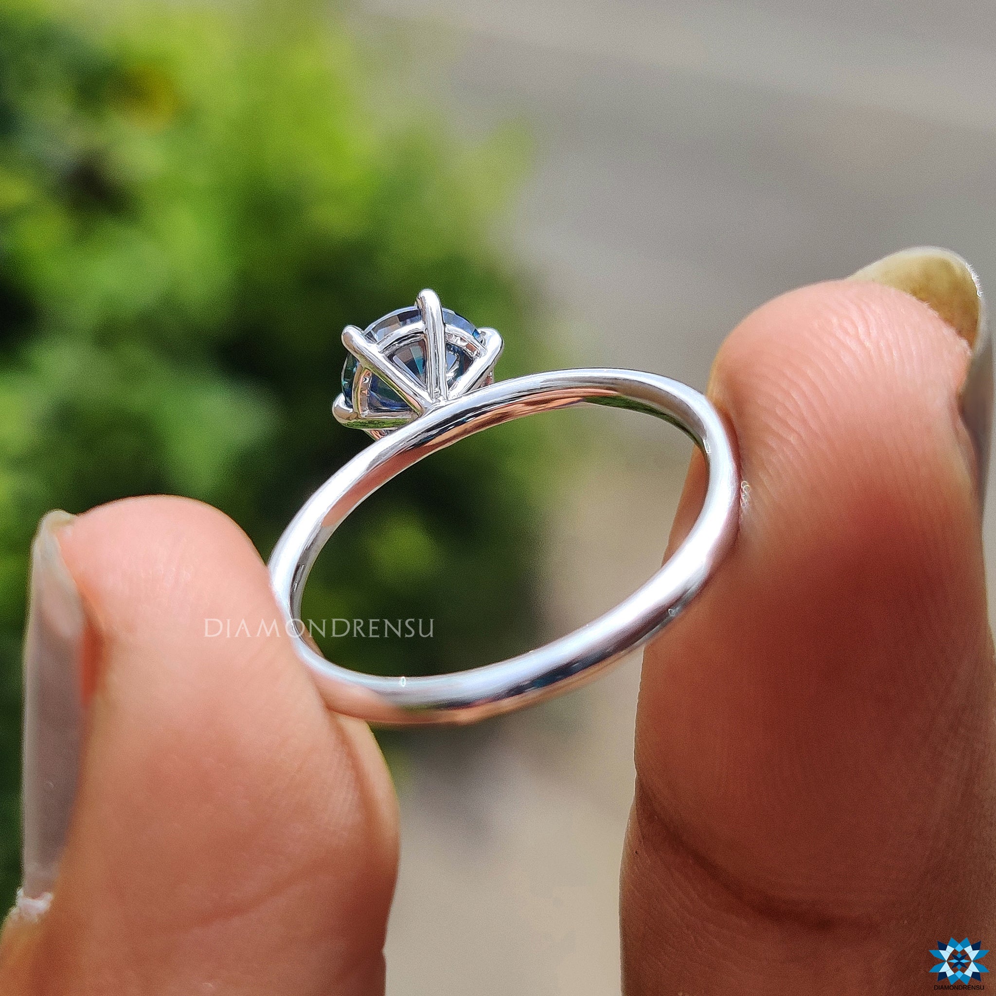Blue moissanite ring set in white gold with precision and care.

