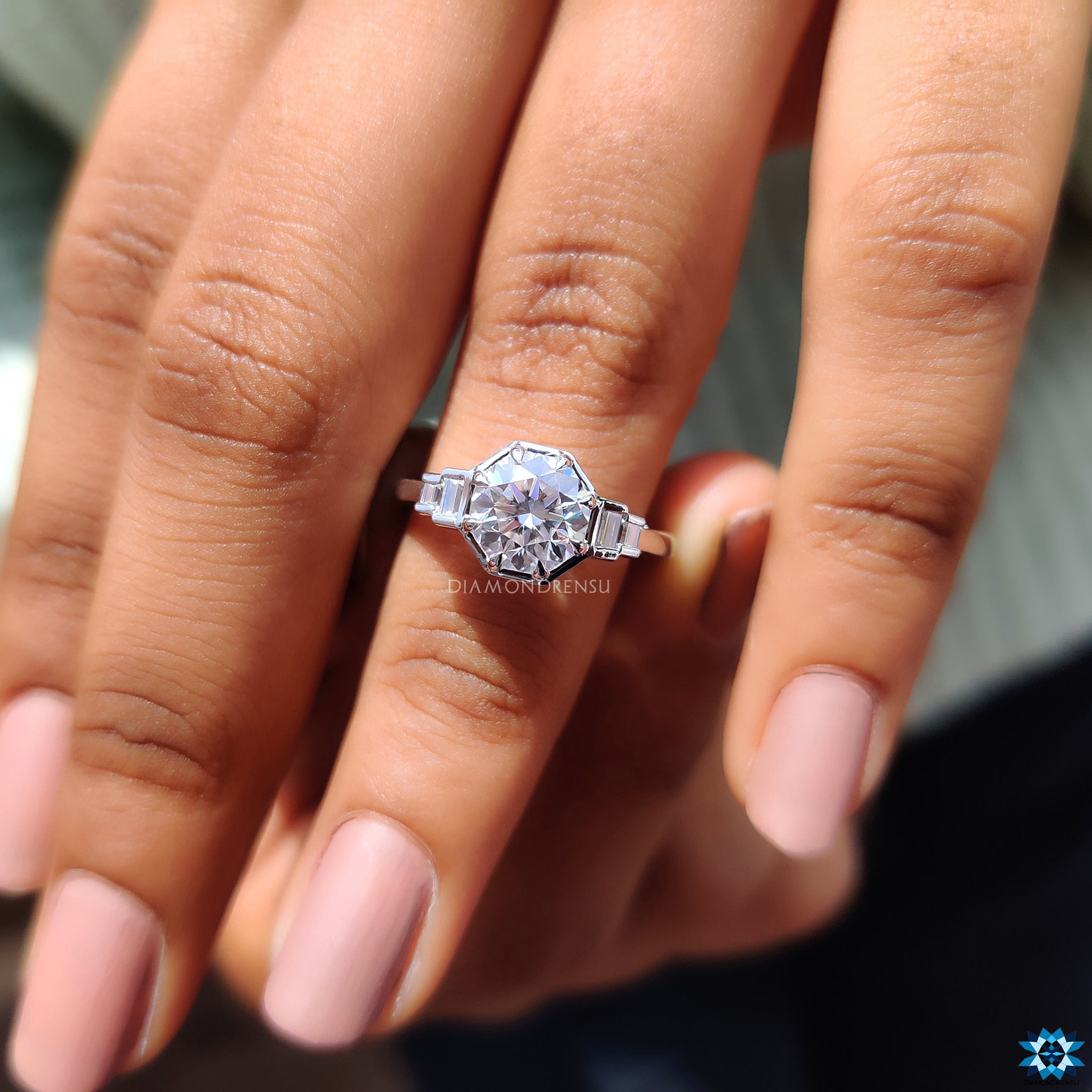 Buy moissanite ring from Diamondrensu UK featuring baguette side stones.
