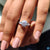 Buy moissanite ring from Diamondrensu UK featuring baguette side stones.
