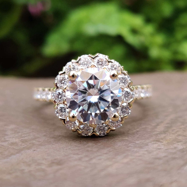 Round cut moissanite engagement ring in white gold.
