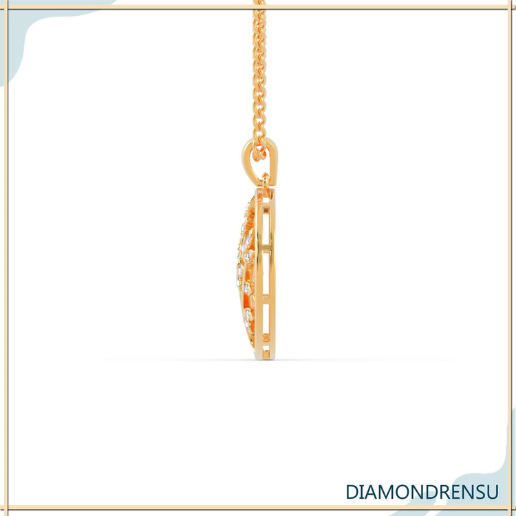 White gold pendant inspired by tree of life symbolism.
