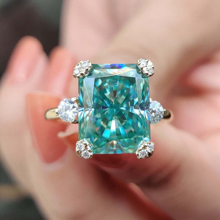Vintage style radiant cut cyan blue moissanite ring.
