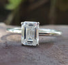 Emerald cut solitaire ring with a classic and elegant design for a timeless look.
