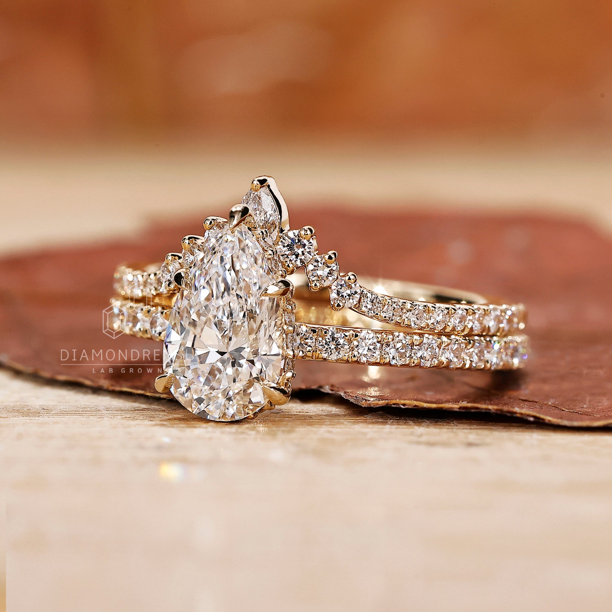 Pear cut diamond ring with matching band.
