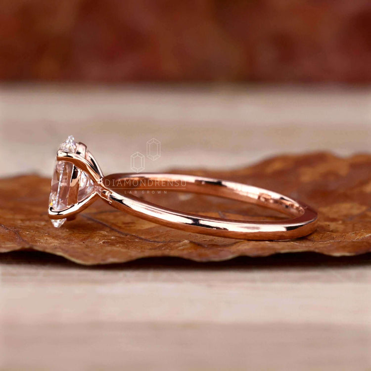 Solitaire oval diamond ring with a prong setting, crafted for special occasions.