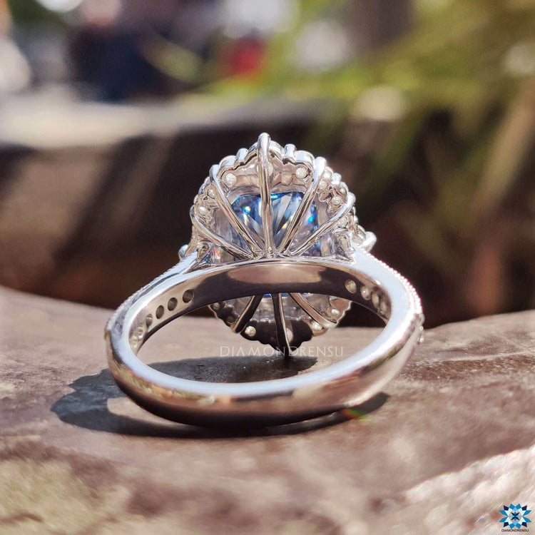 Handmade white gold ring with milgrain and cathedral setting.
