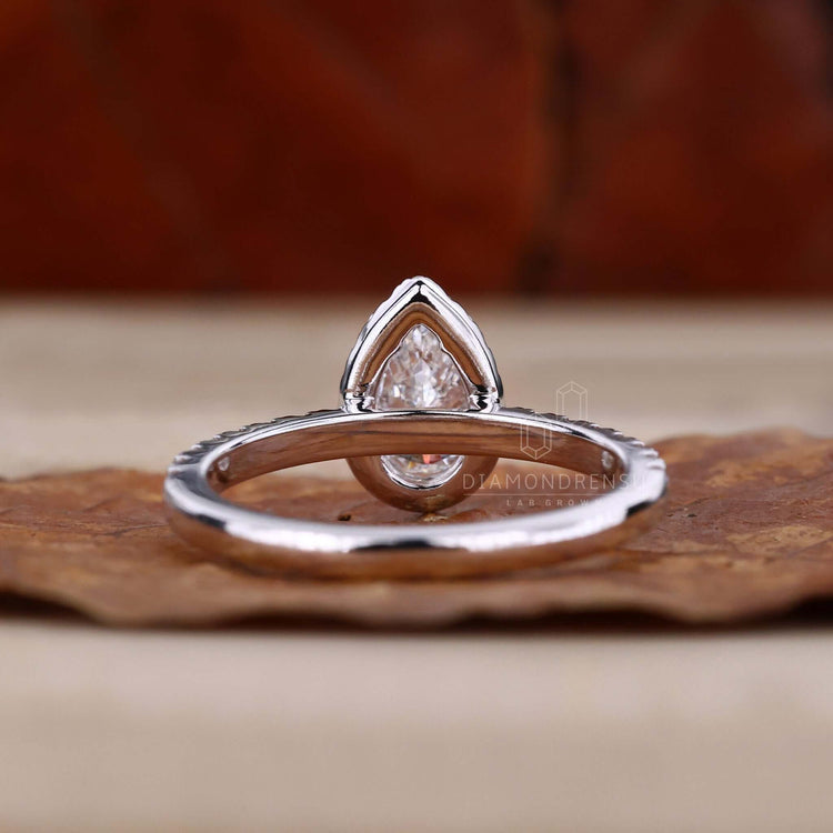 Halo ring setting in a pave diamond ring design, perfect for a romantic UK engagement ring.
