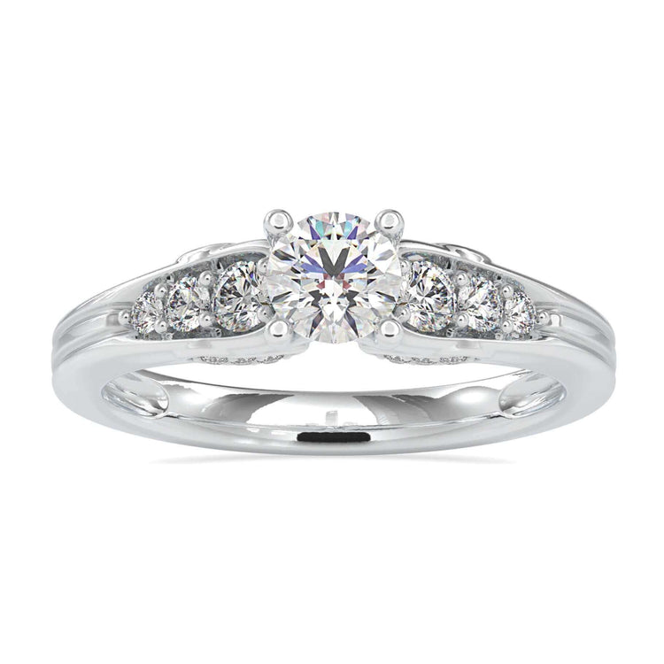 Brilliant cut diamond ring with tapered band and 7 round stones.
