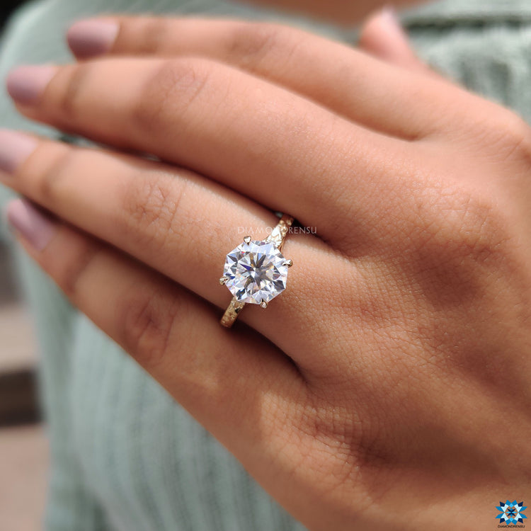 Art Deco style moissanite engagement ring in yellow gold.
