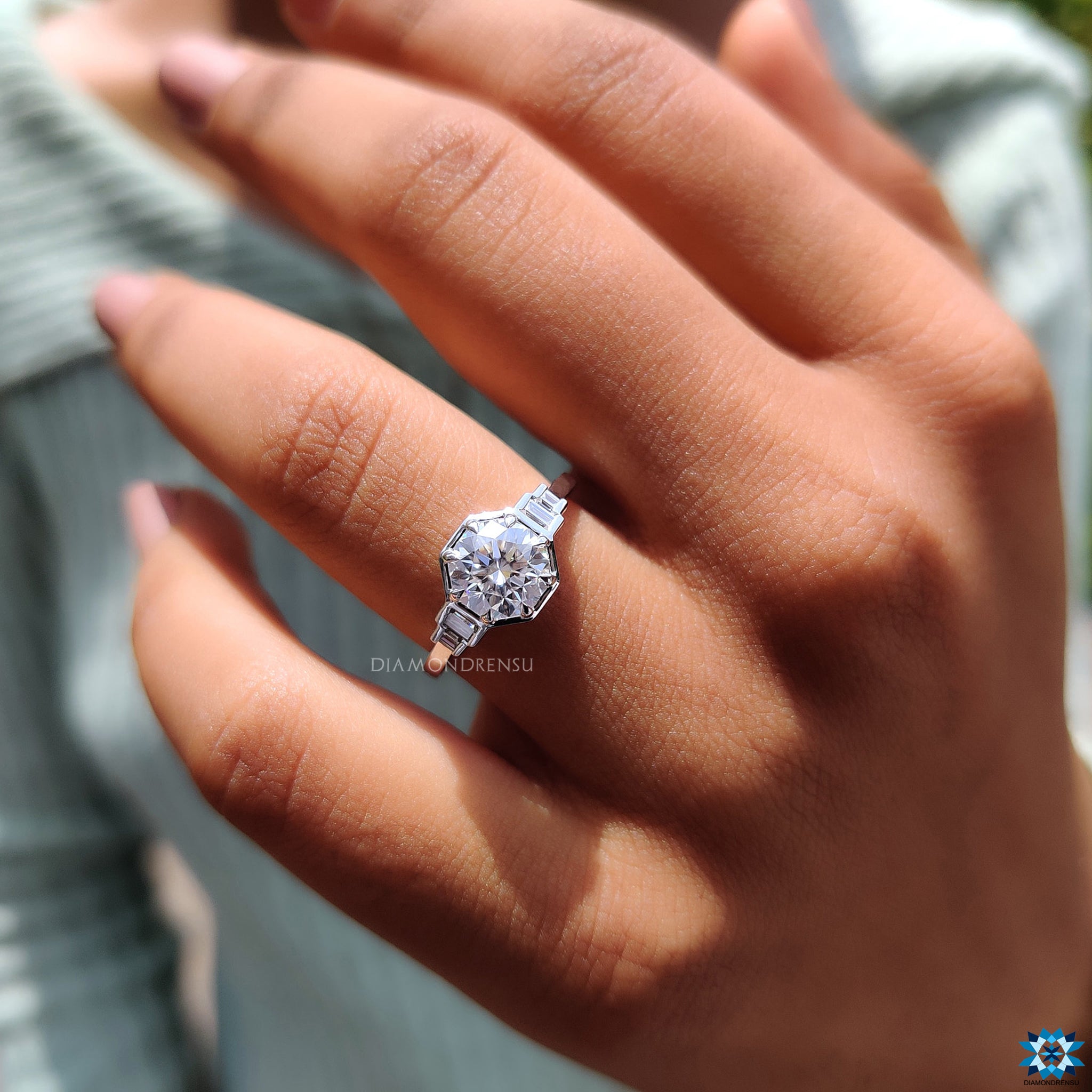Moissanite engagement ring with custom round centre and baguette accents.
