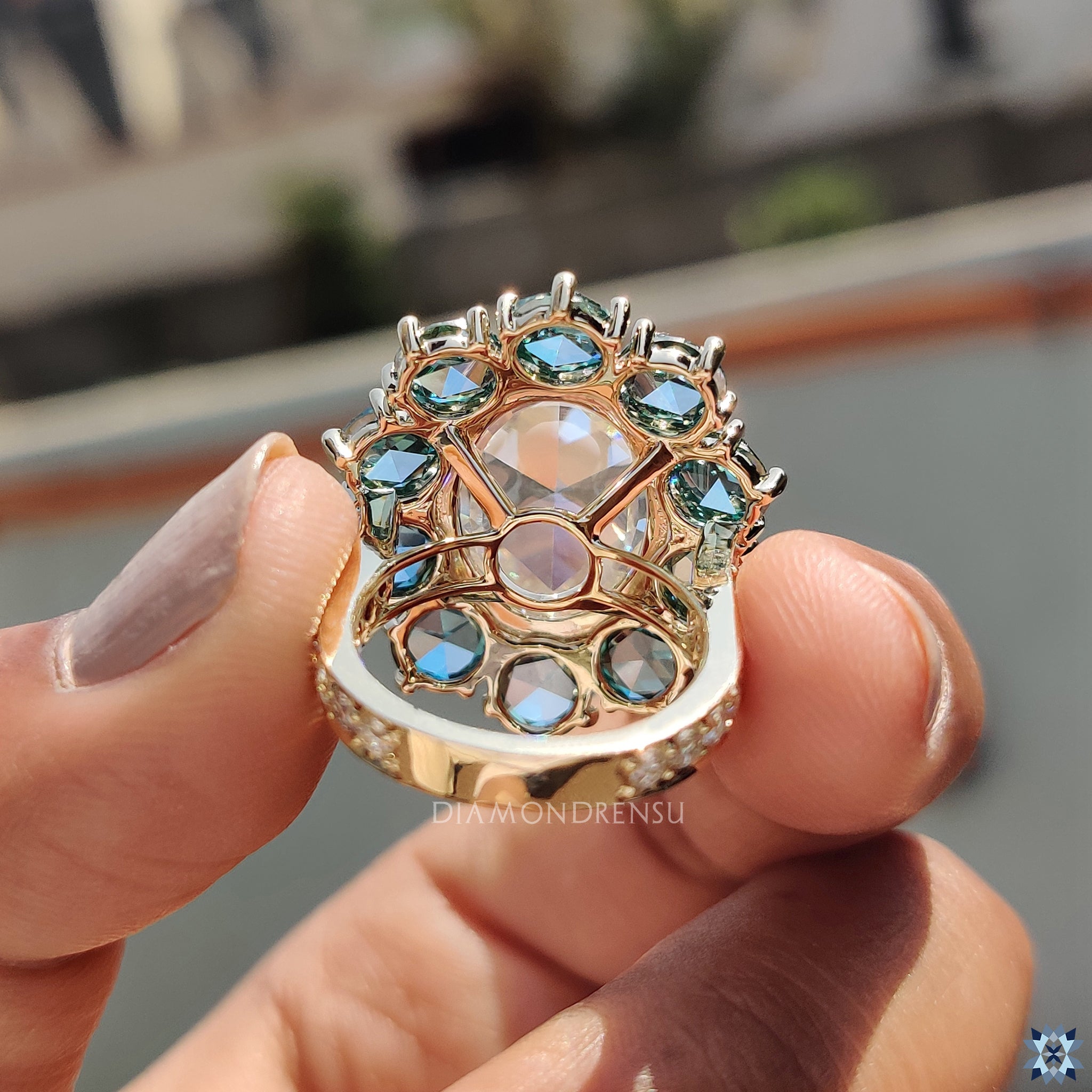 Rose cut ring in cluster halo engagement ring design
