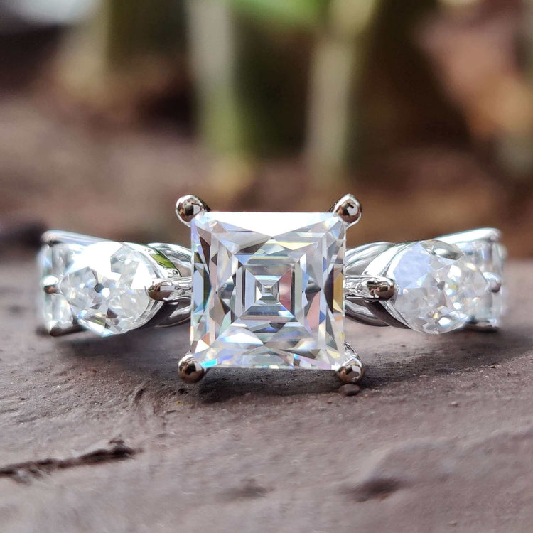5 stone engagement ring with French old European cut center.
