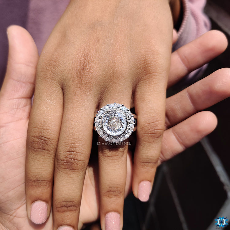 Handmade jewellery ring with bezel halo and split shank design.
