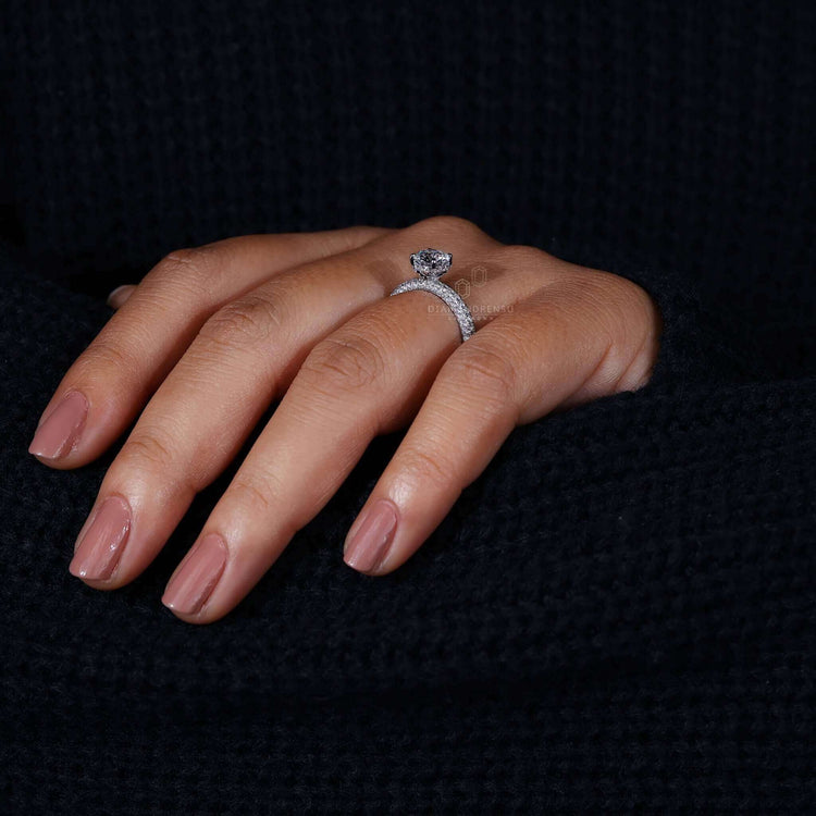 Pave setting on a round diamond engagement ring with a classic 4 prong design, perfect for women seeking elegance.
