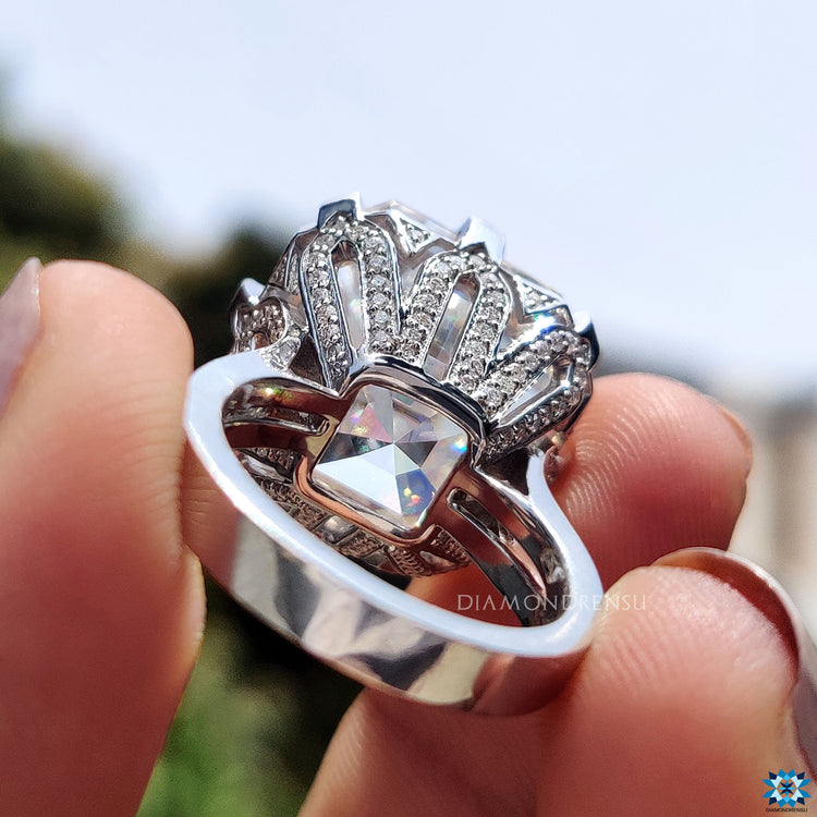 Diamondrensu UK engagement ring with crown motif and cathedral setting.
