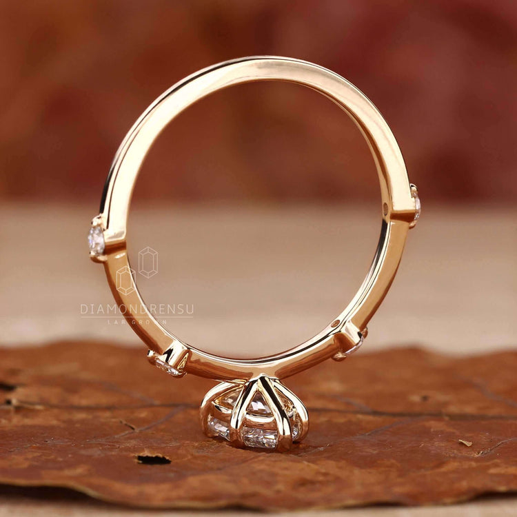Pear cut diamond engagement ring set in a handmade jewelry design, showcasing ethical beauty with igi certified quality.