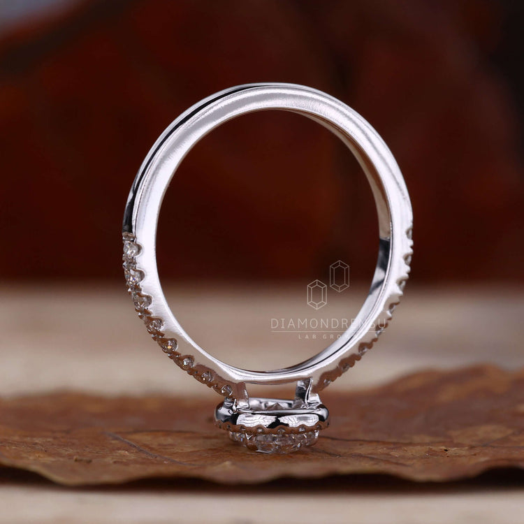 Pear shaped engagement ring featuring pave diamonds and a unique handmade jewellery design.

