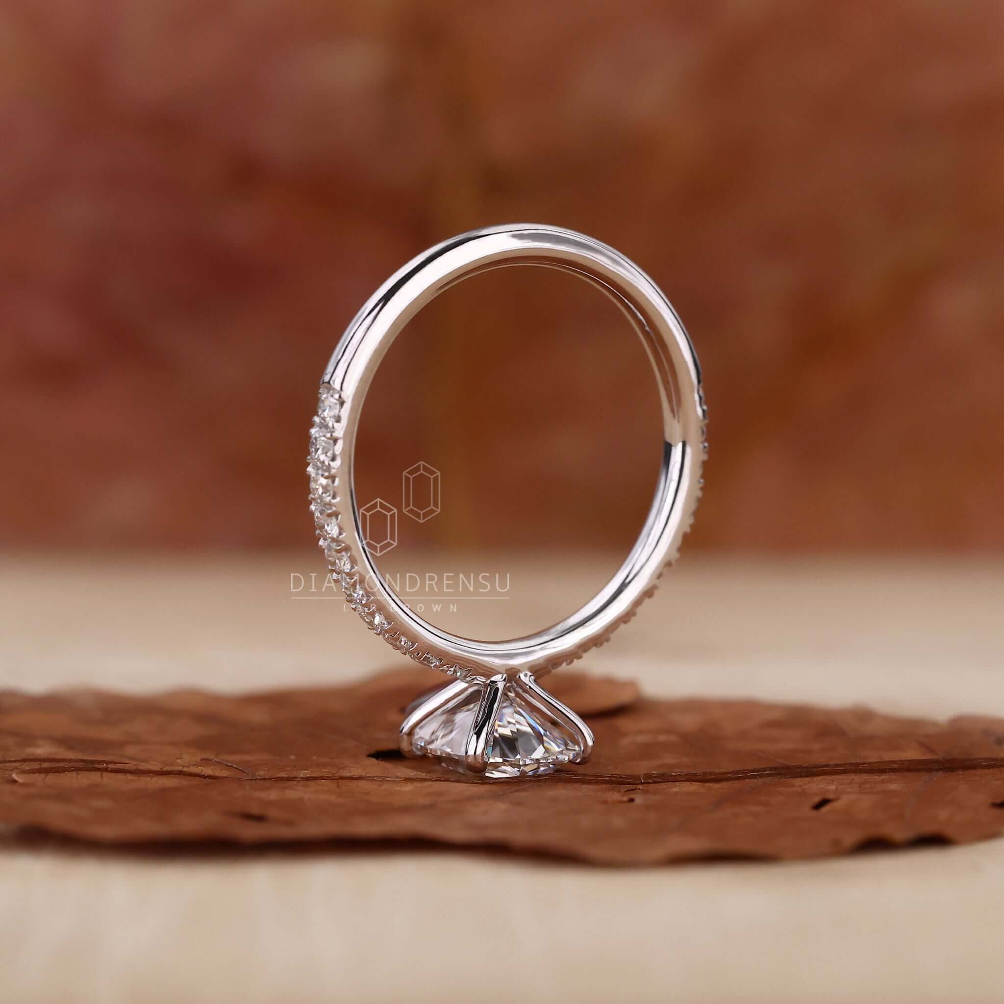 Classic pear shape diamond ring with exquisite detailing.