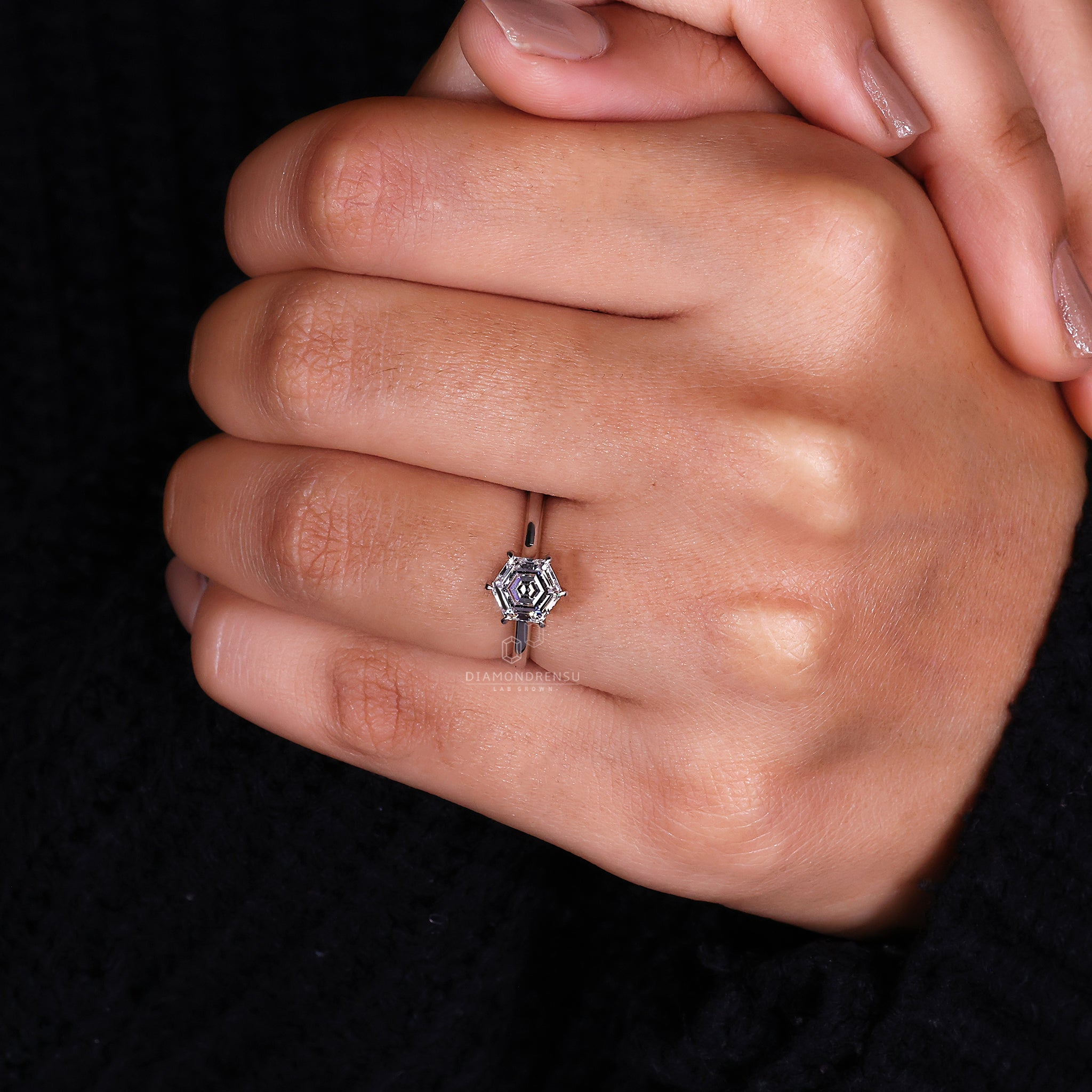 Diamondrensu UK ring featuring a hexagon cut diamond.
