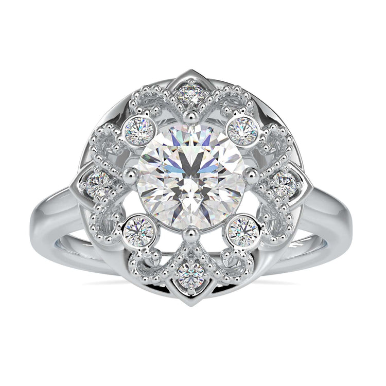 Art Deco diamond ring with round cut centre and milgrain detailing.

