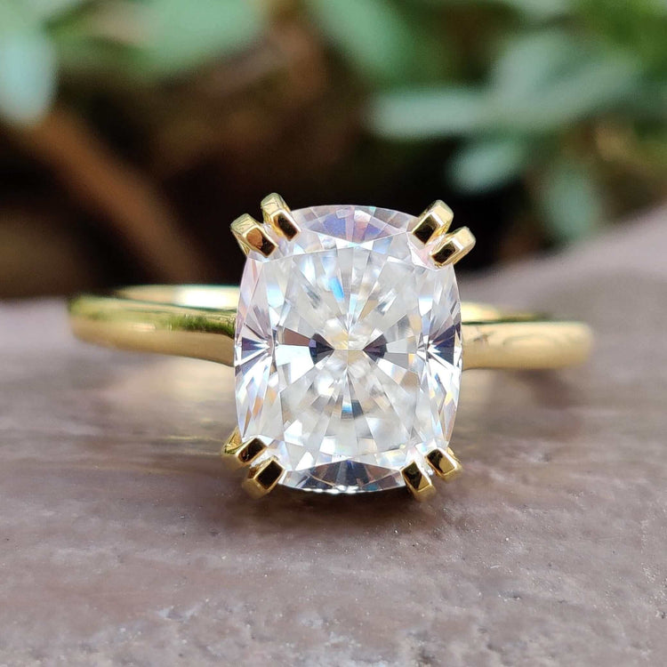 Elongated cushion moissanite solitaire ring.
