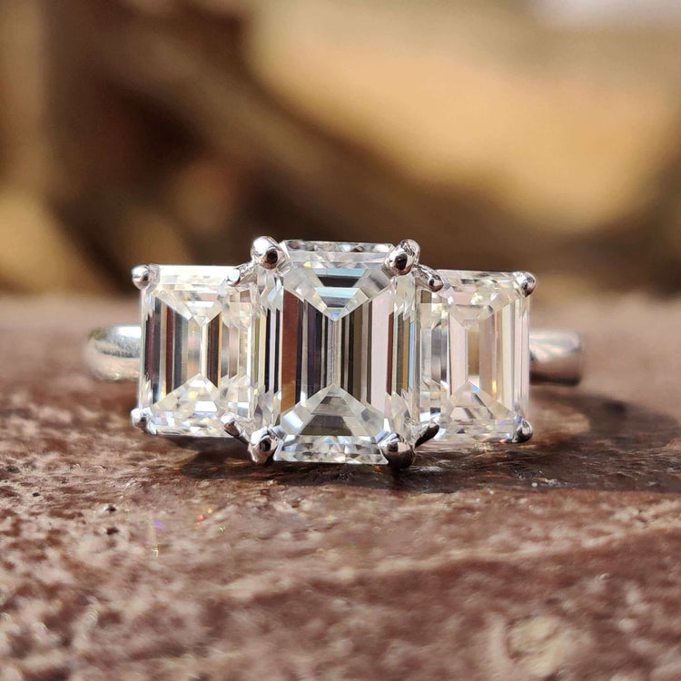 Emerald cut moissanite engagement ring in white gold.
