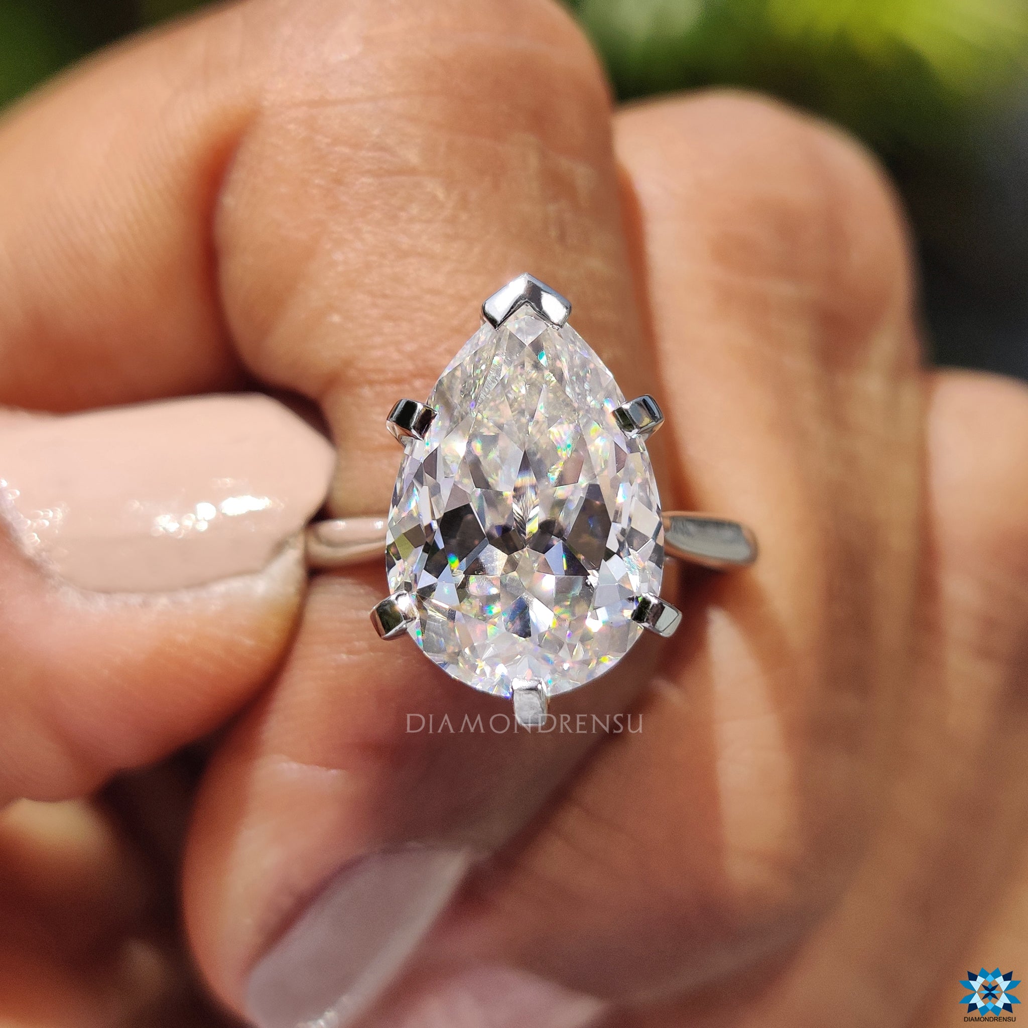 Buy engagement ring with unique pear Rensu cut and handcrafted white gold band.
