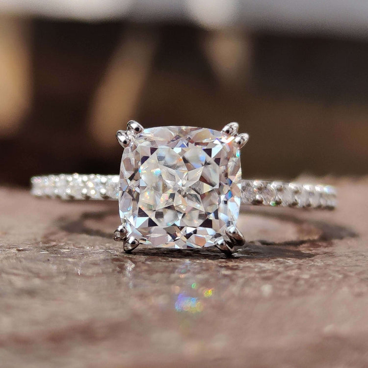 Hidden halo pave engagement ring with cushion rensu cut moissanite.
