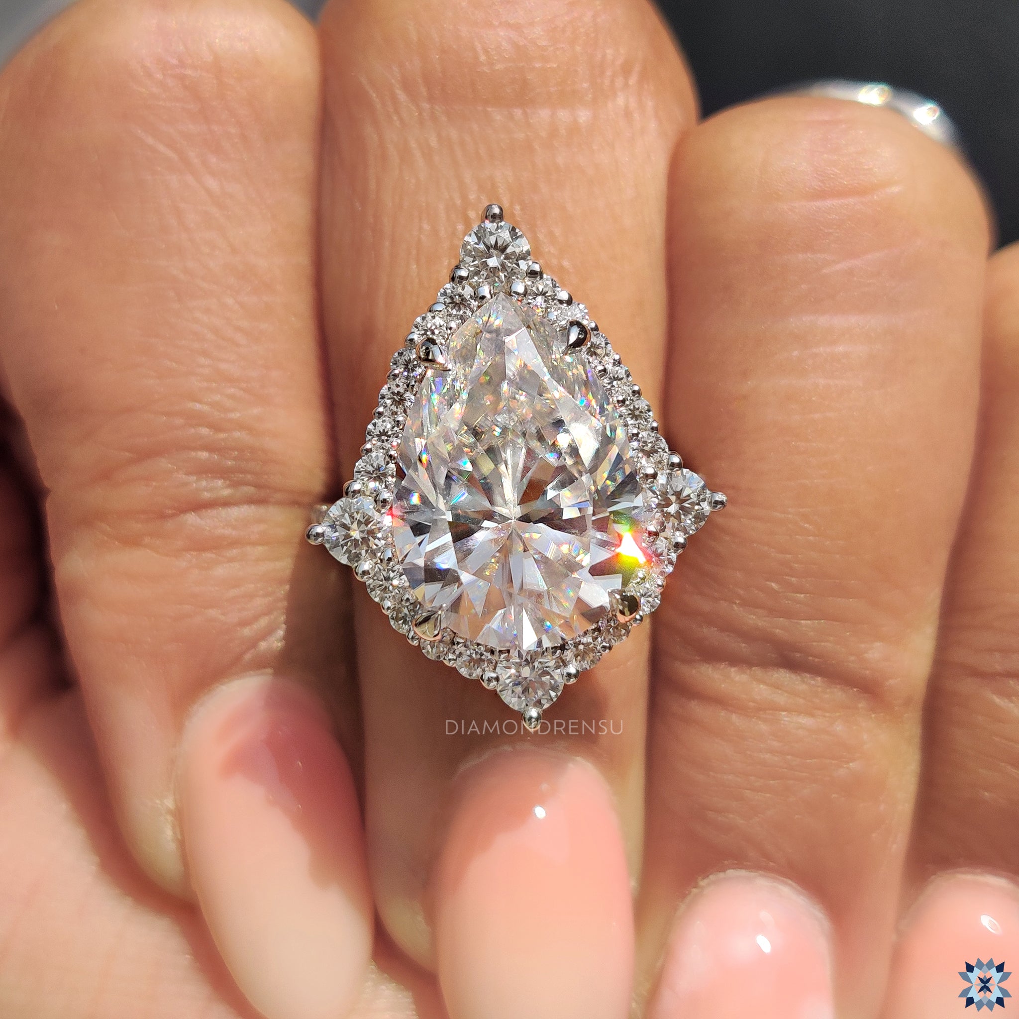 Halo engagement ring in bridge accent ring setting
