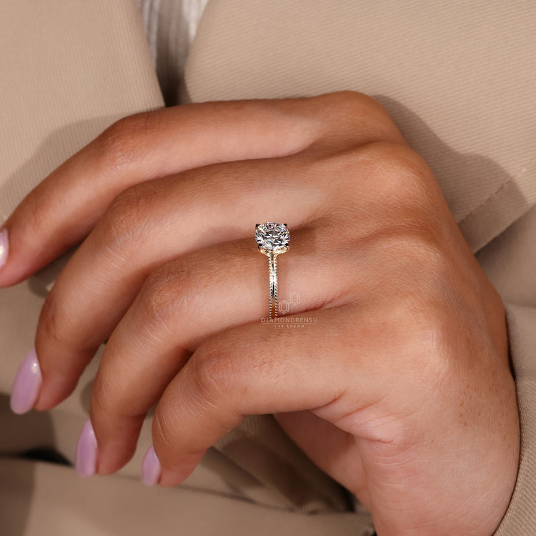 Classic yellow gold engagement ring with milgrain detail