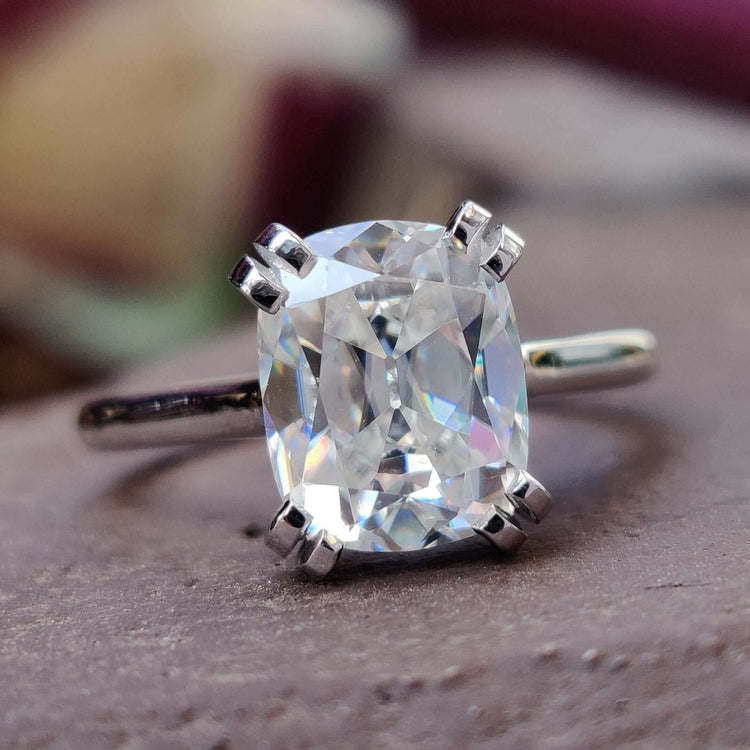 Elongated cushion OEC moissanite engagement ring in white gold.
