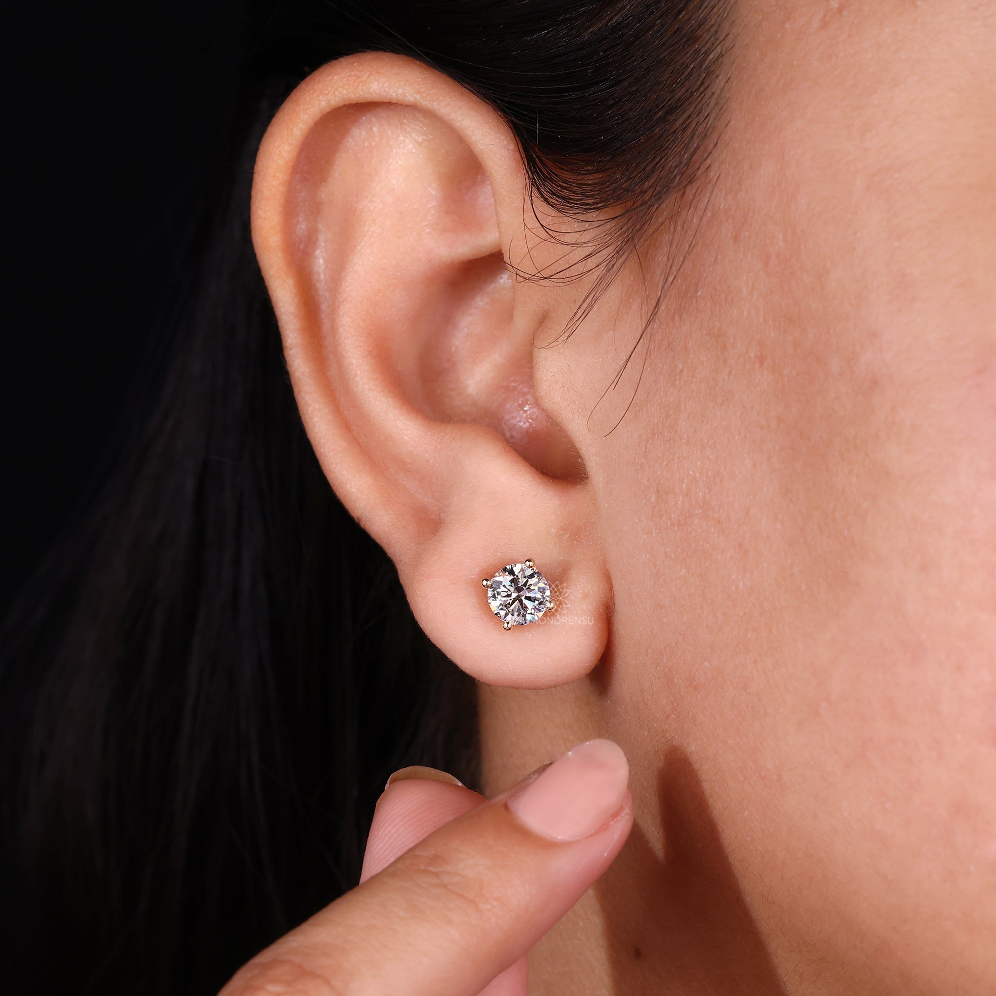 Diamond stud earrings UK with secure 4 prong gold setting.