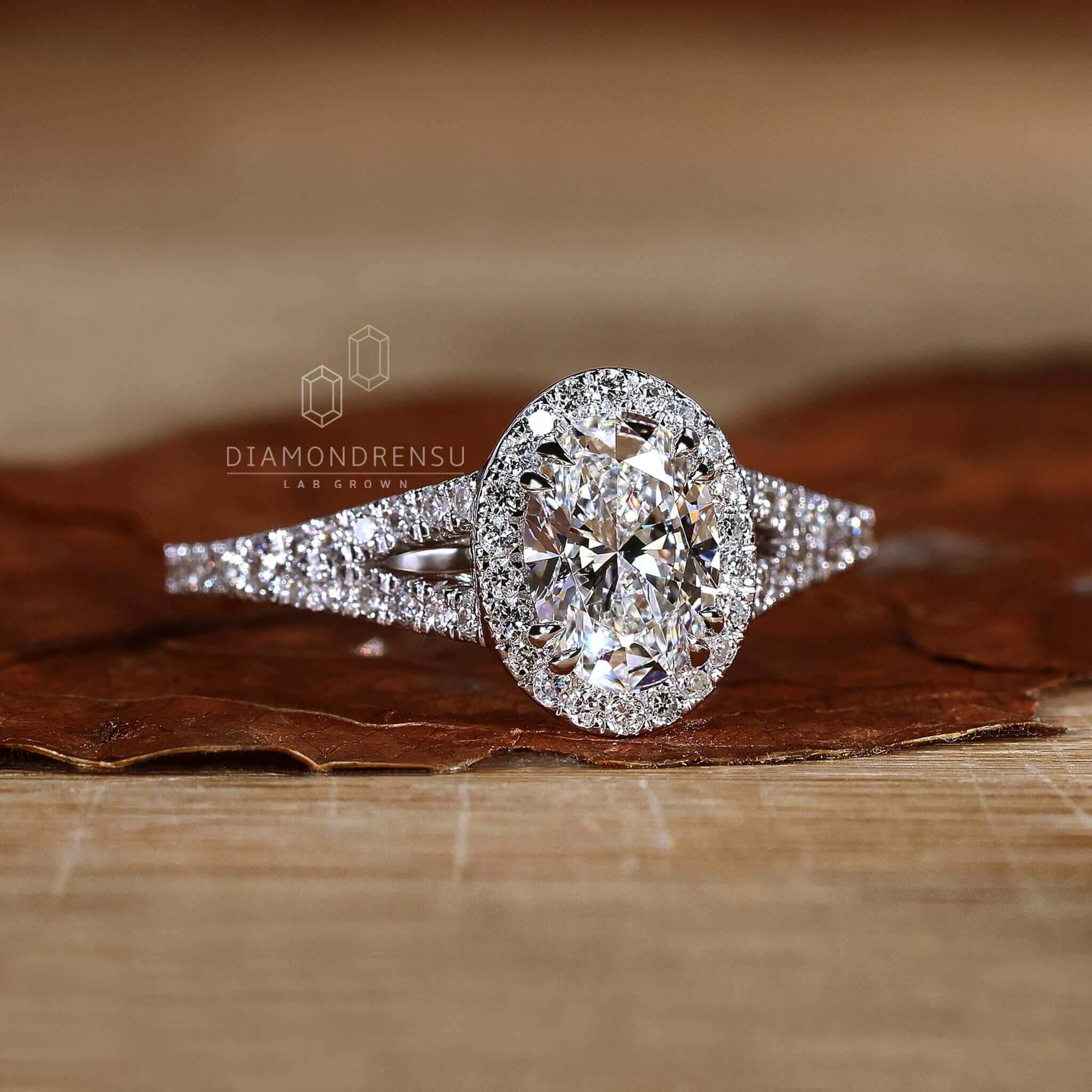 1 carat oval diamond ring with white gold halo setting.
