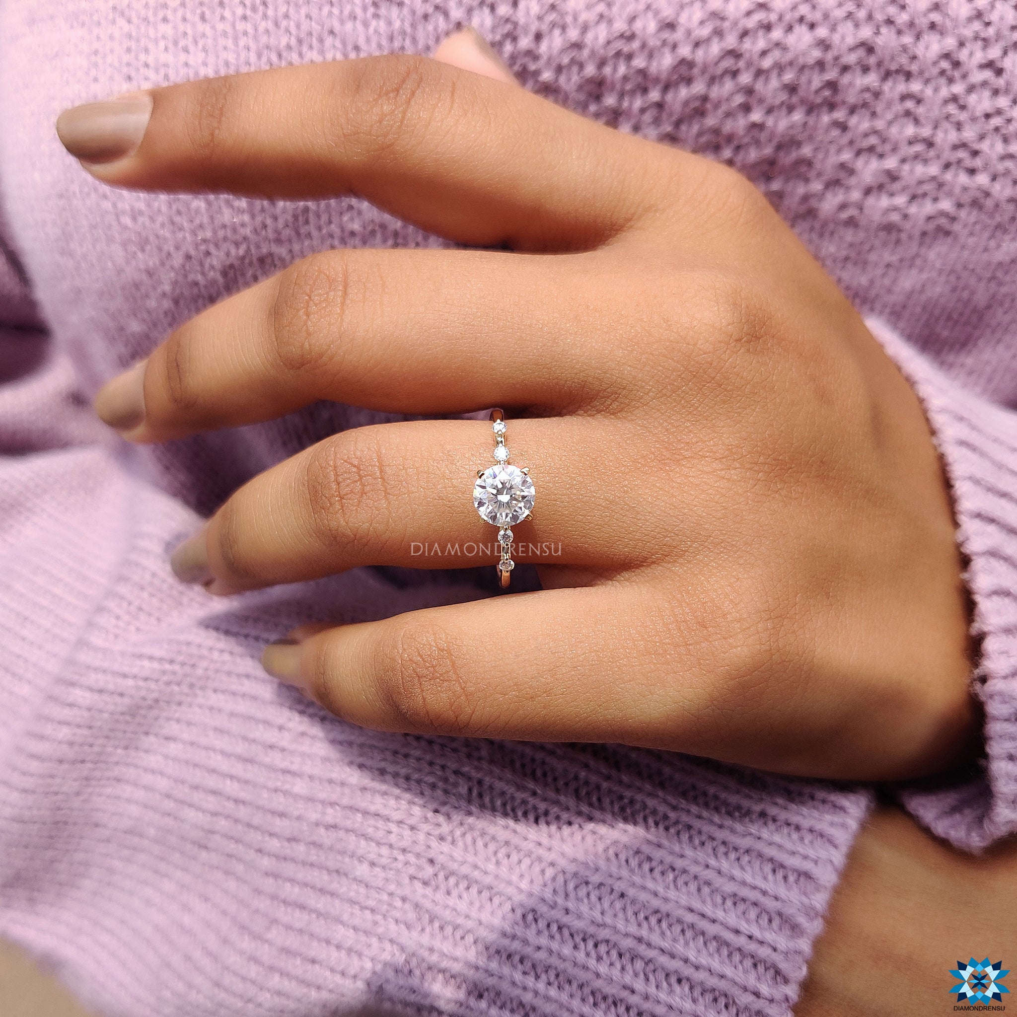 Diamondrensu UK engagement ring with 1 carat center stone and prongs.
