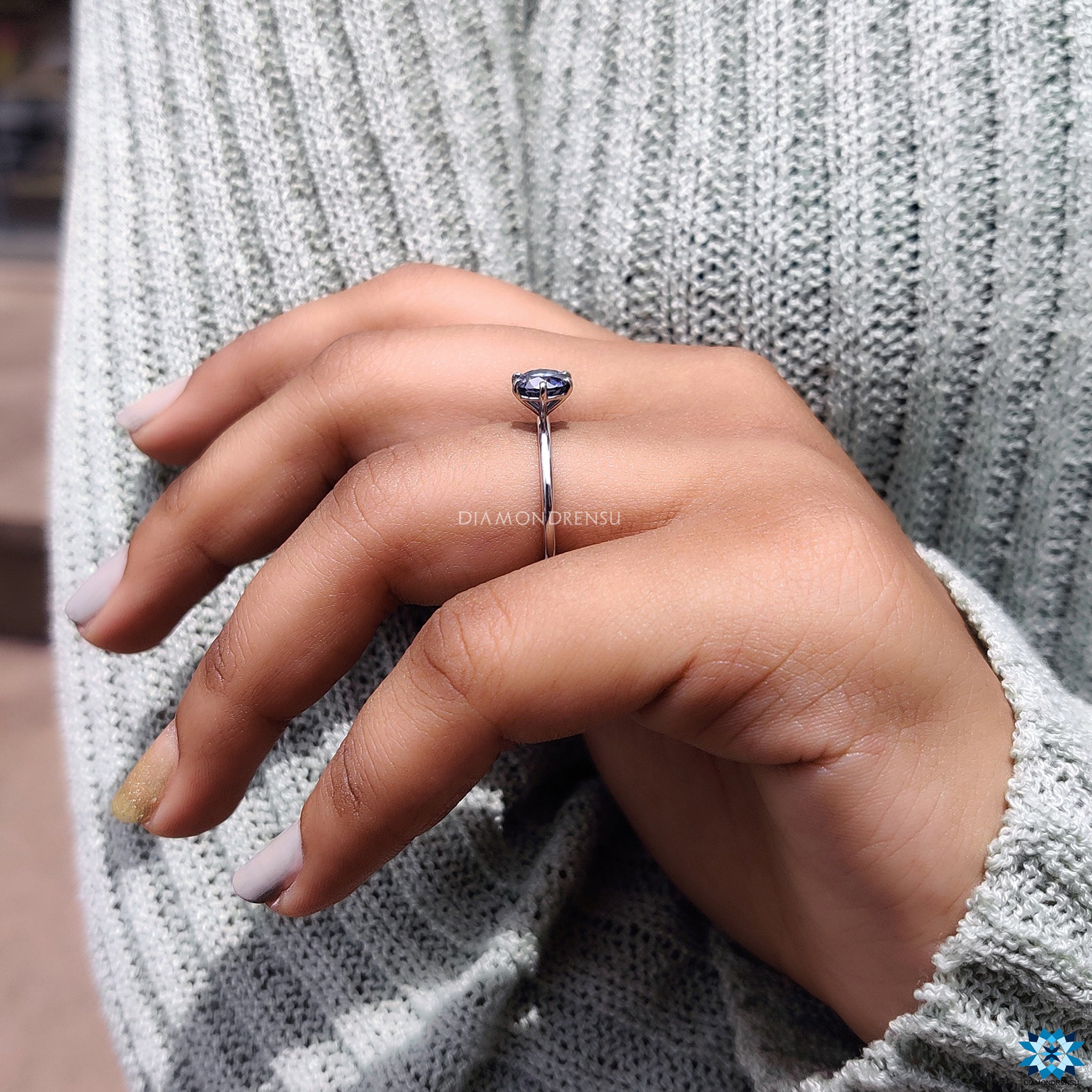 Diamondrensu UK engagement ring featuring a solitaire moissanite design.
